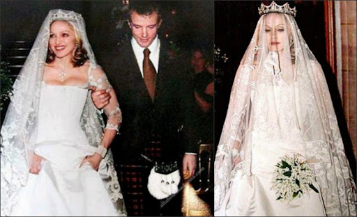 Madonna and Guy Ritchie dressed in their wedding attire walk arm and arm.